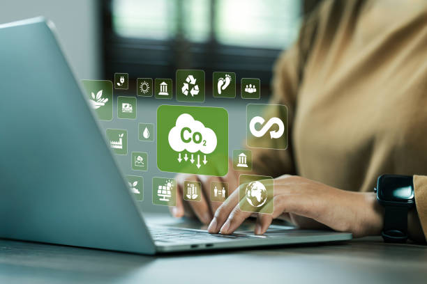istock environmentally friendly carbon concept Along with green nature, reducing carbon dioxide. business woman working on modern computer virtual reality to reduce CO2 emissions 2153783684