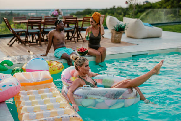 istock Blonde girl chilling in the float by the pool 2153788332