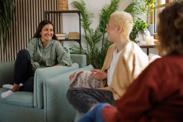 istock Female friends talking at home 2153788827