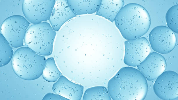 istock 3D rendering of blue water bubbles with droplets. Macro shot simulation with copy space. 2153790479