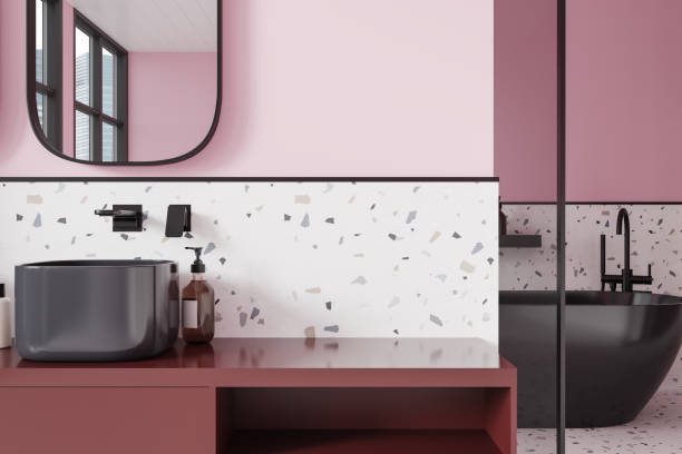 istock Colored hotel bathroom interior with sink and bathtub behind partition 2153790579
