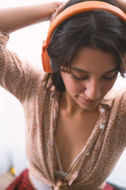 Young woman listening to music.