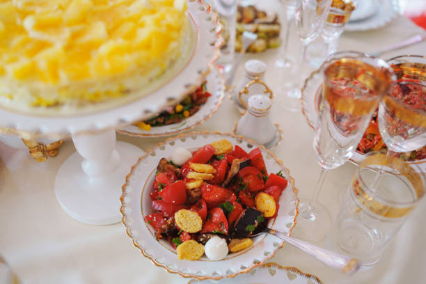 istock salad on the table is served with classic white and gold dishes. 2153800628