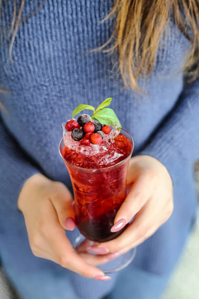 istock Woman Holding Berry-Infused Drink 2153801026