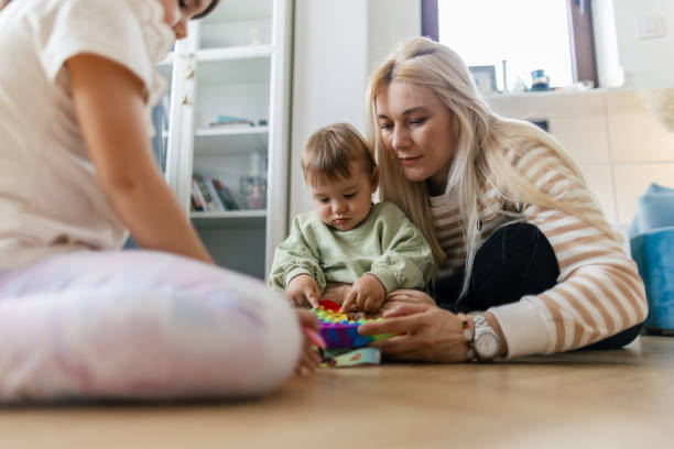 istock Mother playing with her son and daughter 2153801499