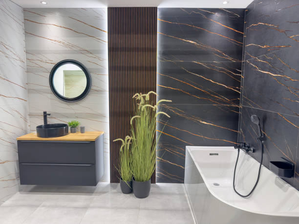 Modern minimalistic bathroom interior with ceramic bathtub  in home comfortable apartment. Design concept