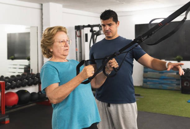 istock Elderly patient doing strength exercises with her physiotherapist. 2153807378