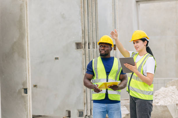istock Engineer smart women working contact with African black worker in Precast concrete casting manufacturing company site inspector 2153810000