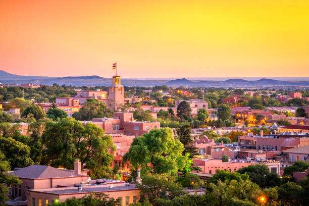 Santa Fe, New Mexico, USA at Dusk Santa Fe, New Mexico, USA downtown skyline at dusk. adobe material stock pictures, royalty-free photos & images