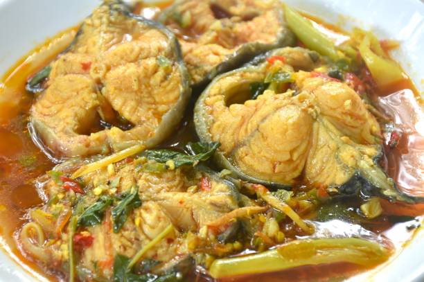 spicy boiled catfish with basil and chili in curry soup