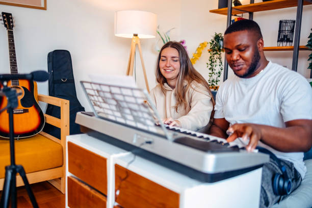 istock Two young musicians making music at home 2153812689