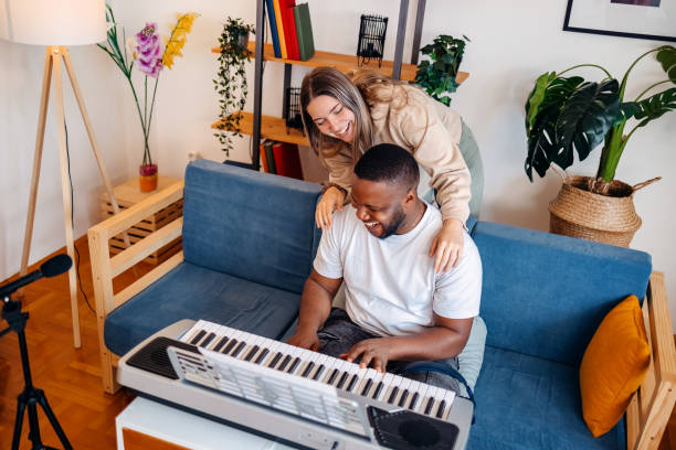 istock Two young musicians making music at home 2153812720