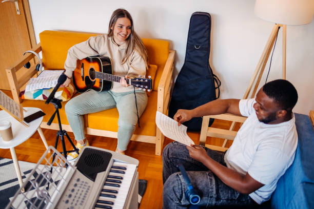 istock Two young musicians making music at home 2153812734