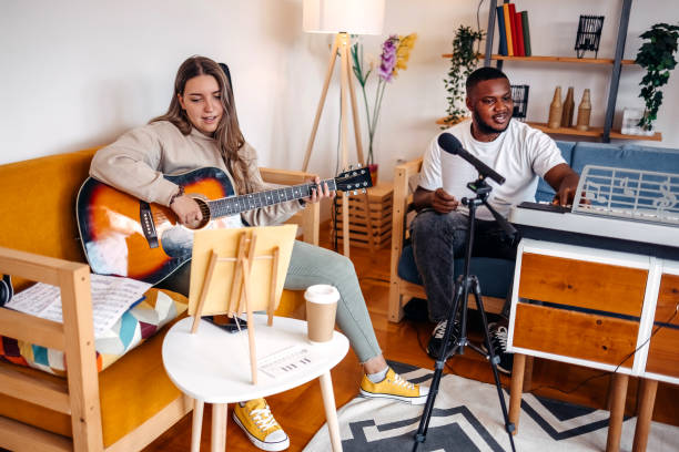 istock Two young musicians making music at home 2153812754