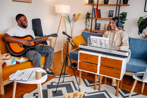 istock Two young musicians making music at home 2153812814