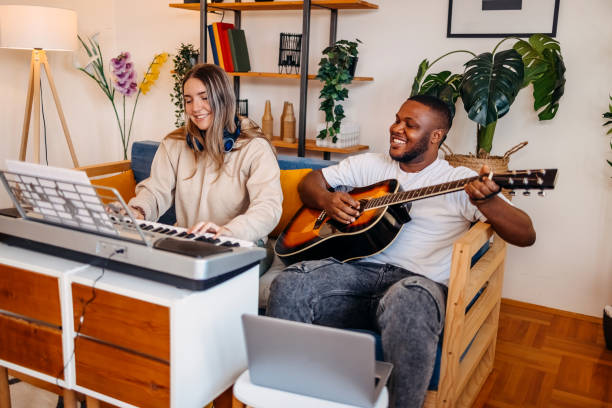 istock Two young musicians making music at home 2153813004