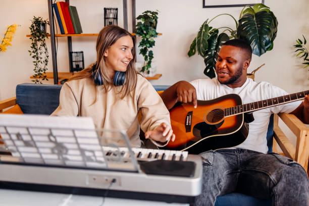 istock Two young musicians making music at home 2153813013
