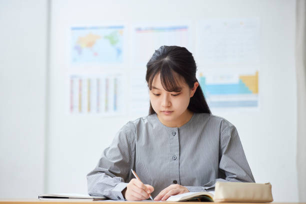 istock High school girls taking classes at a prep school 2153813662