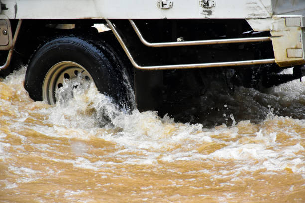 istock Flood water with car 2153815430