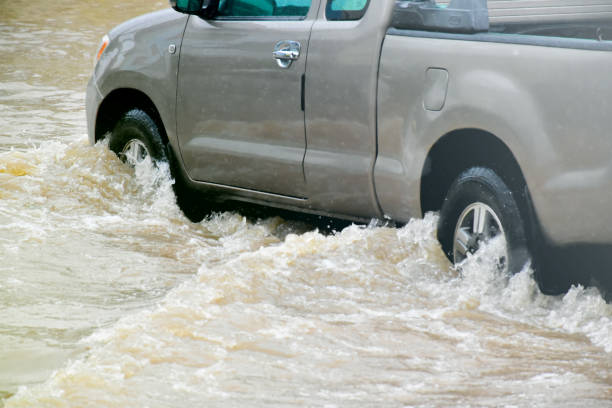 istock Flood water with car 2153815432