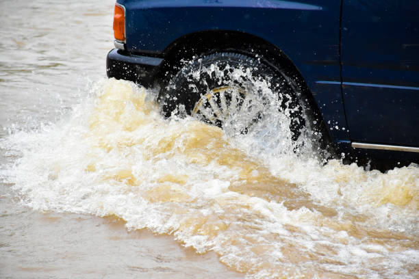 istock Flood water with car 2153815435