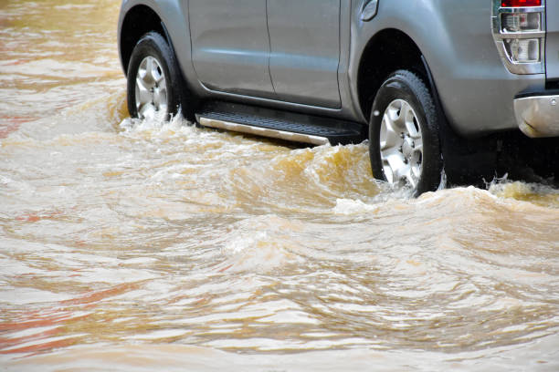 istock Flood water with car 2153815446