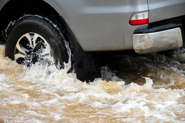istock Flood water with car 2153815463