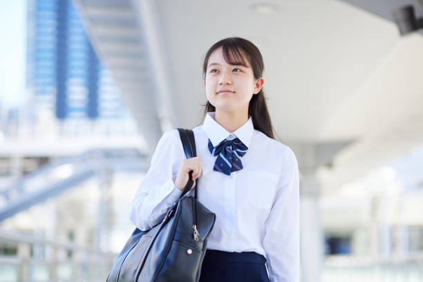 istock Japanese high school girl wearing summer uniform while commuting to school 2153815521