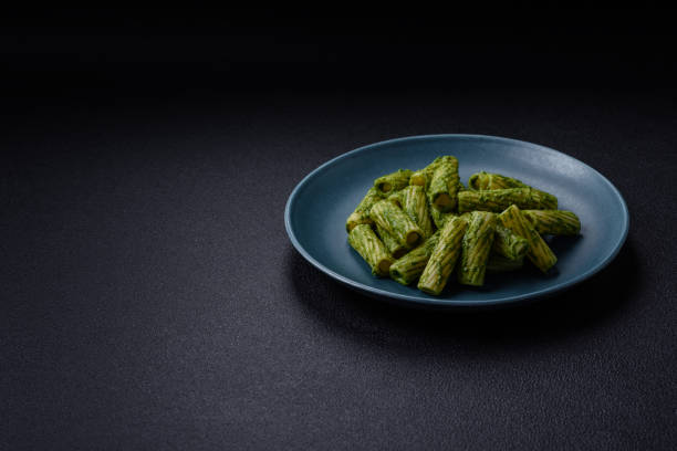 istock Delicious pasta with spinach sauce, olive oil and parmesan cheese 2153815541