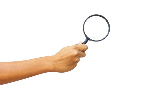 istock A man's hand holds a magnifying glass 2153816833