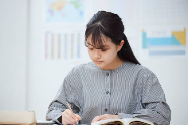 istock High school girls taking classes at a prep school 2153817161