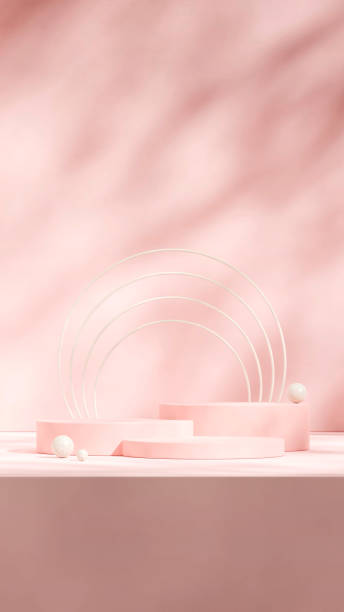 istock blank mockup pink cylinder podium in portrait beige ring and sphere, 3d rendering 2153818413