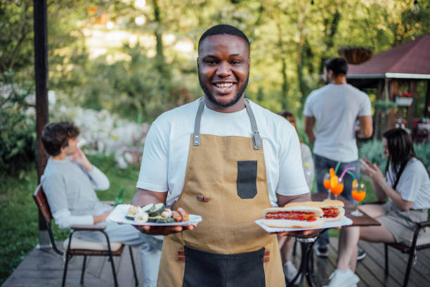 istock Man with food at a barbecue party 2153819961
