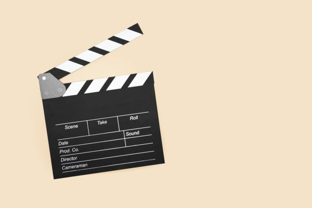 istock Cinema clapper board on a beige  background, copy space, filming process,television production tool, motion picture 2153820259
