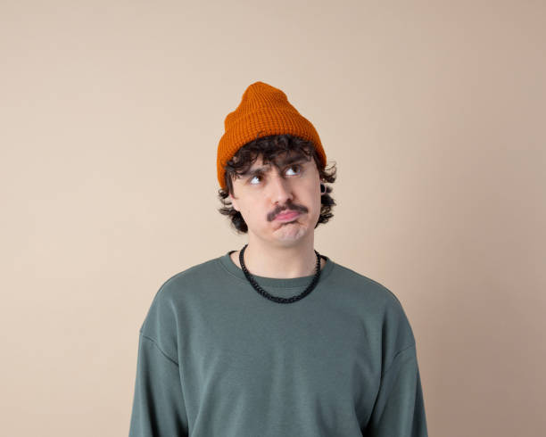 istock Headshot of confused young man 2153821093