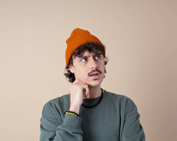 istock Headshot of confused young man 2153821137