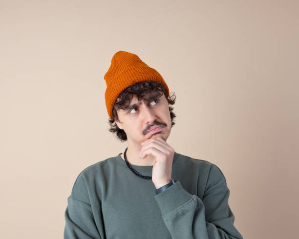 istock Headshot of confused young man 2153821183