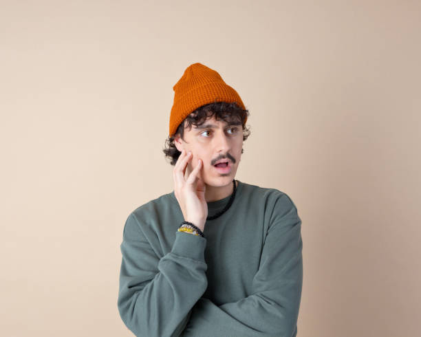 istock Headshot of confused young man 2153821207