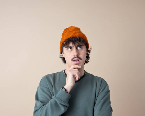 istock Headshot of confused young man 2153821221