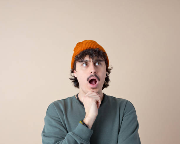 istock Headshot of surprised young man 2153821333
