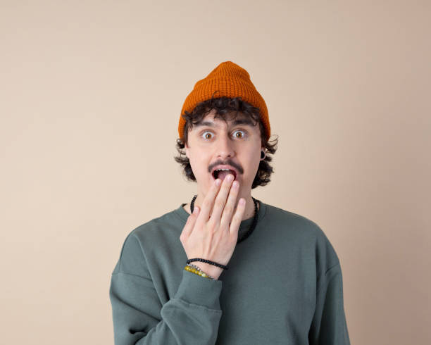 istock Headshot of surprised young man 2153821359