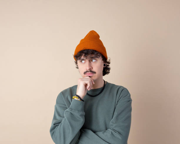 istock Headshot of thoughtful young man 2153821402