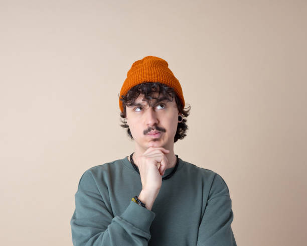 istock Headshot of thoughtful young man 2153821414