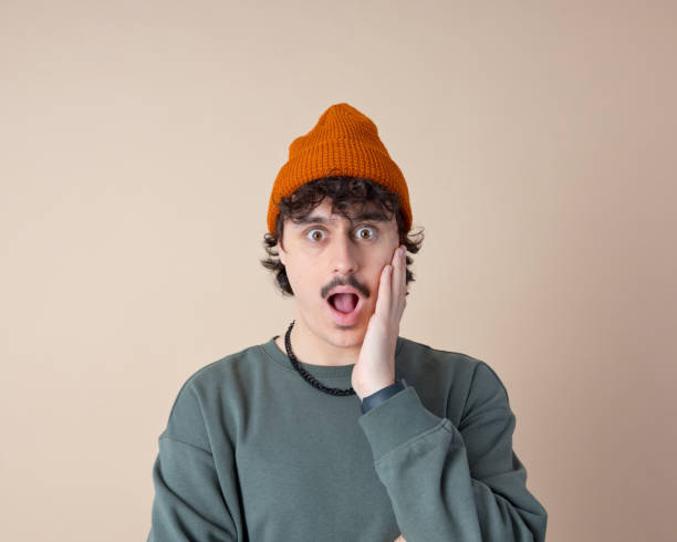 istock Headshot of surprised young man 2153821427