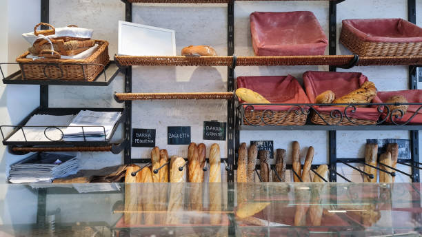 istock Bread Variety and News: Bakery Display Featuring Assorted Loaves and Newspapers 2153822544