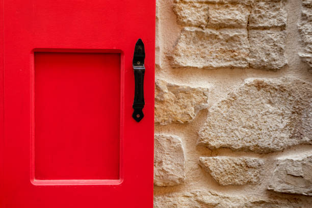 red door or window new painted on old style stone brick textured wall background