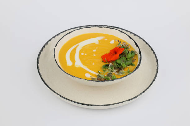 istock Tasty pumpkin Soup with cream in a bowl on a white background 2153824764