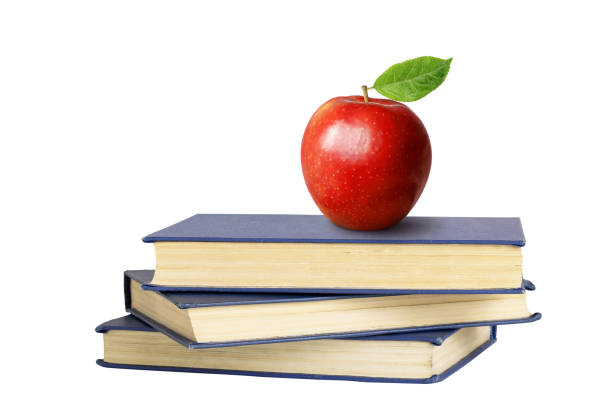 istock Books and an apple isolated 2153826800