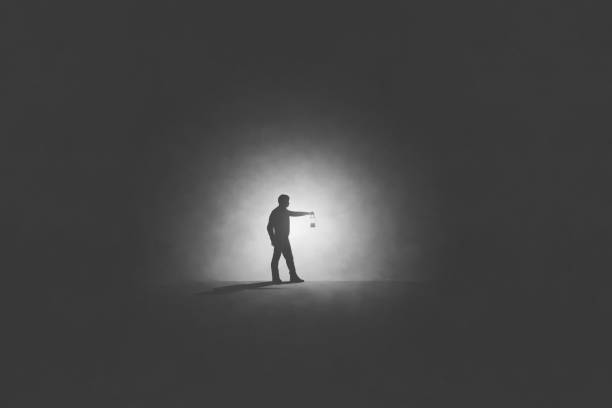 istock Illustration of man with lamp walking illuminating his path, surreal abstract concept 2153829792