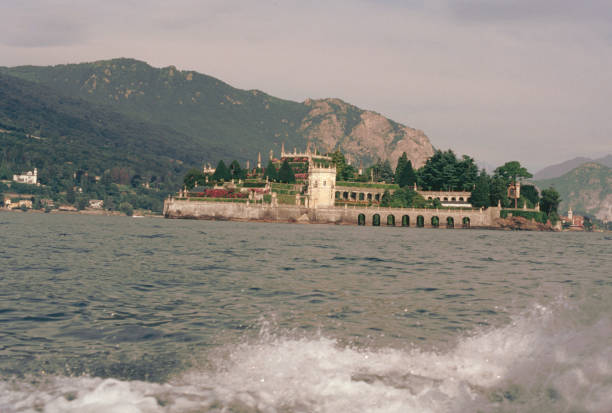 Lake Maggiore, Piedmont, Italy, 13 August 1992: the motorboat proceeds from the town of Stresa towards the splendid Isola Bella, very popular with tourists. The Garden of Love is visible.
